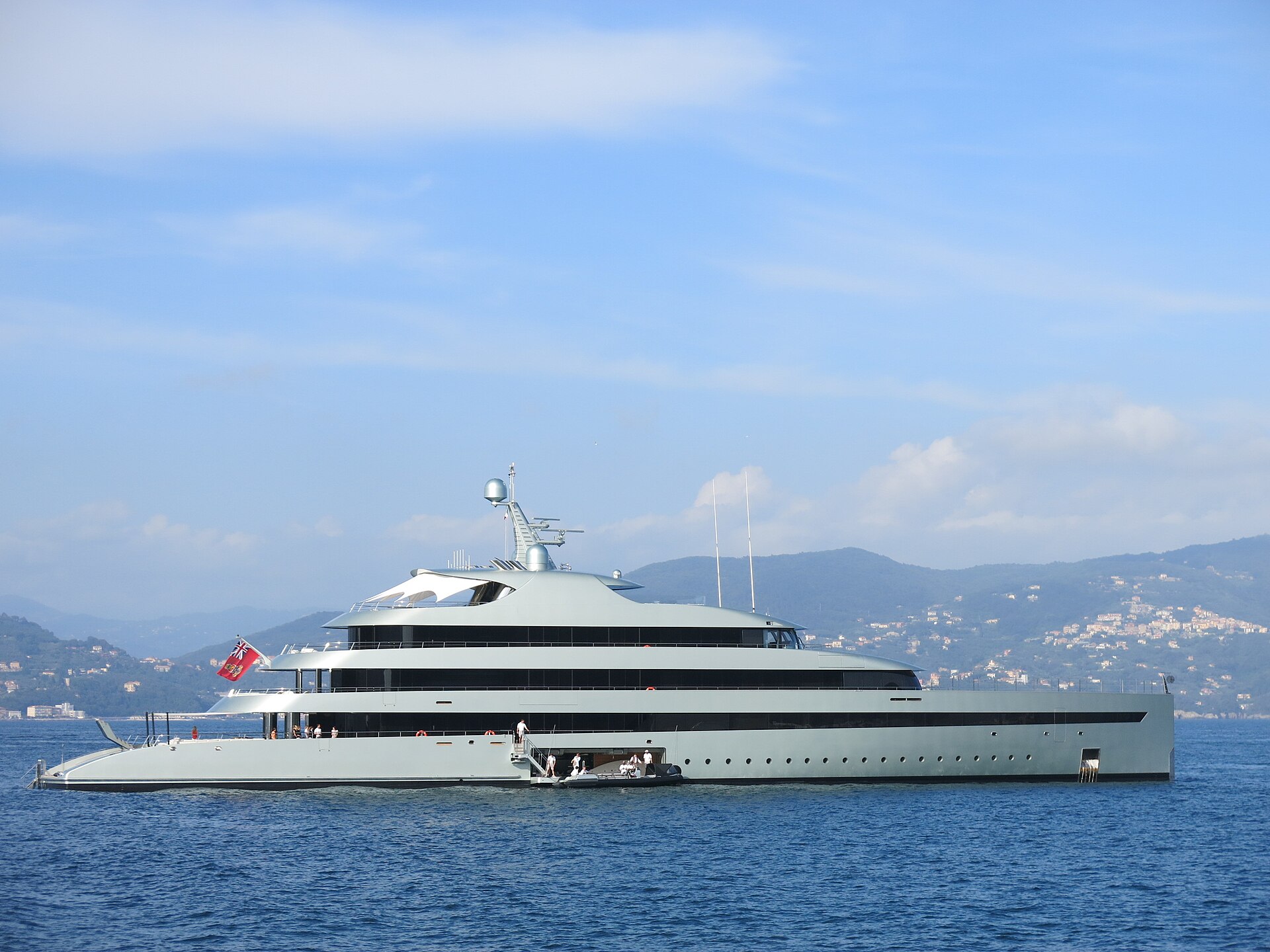 A large motor yacht at anchor in calm water