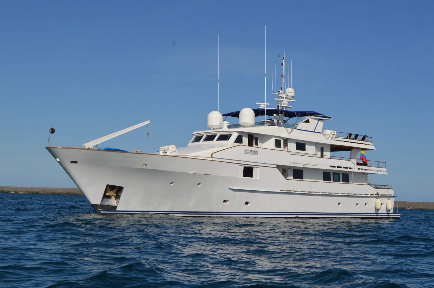 A modern flybridge motor yacht underway